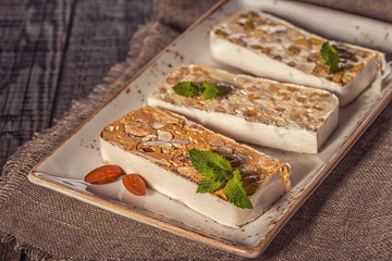 Nougat with honey and nuts, selective focus.