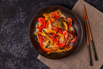 Cooking asian stir fry noodles with vegetables