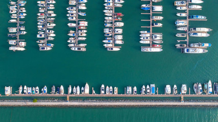 Pier speedboat. A marina lot. This is usually the most popular tourist attractions on the beach.Yacht and sailboat is moored at the quay.Aerial view by drone.Top view.