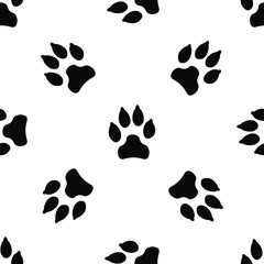 Fototapeta premium Seamless pattern with black dog track isolated on white background. Animal footprint silhouette. Background with pet track.