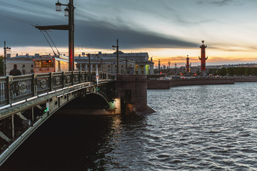 Fototapeta premium St. Petersburg sunset cityscape, famous bridge, view to Vasilievsky Island