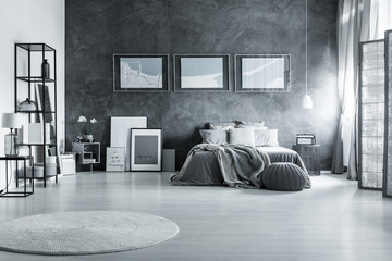 Loft gray bedroom with posters