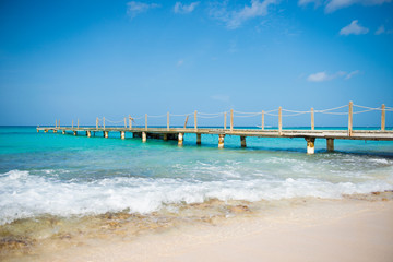Wooden bridge over the sea. Travel and Vacation. Freedom Concept.
