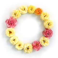 Round frame with roses isolated on white background. Flat lay, top view