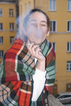 Young woman smoking a cigarette