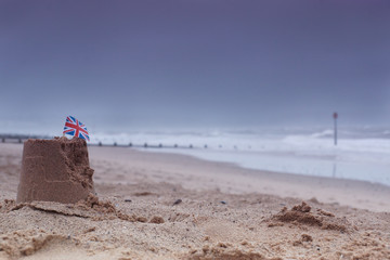 Beaches lay empty in bad weather at the height of summer at Dawlish Warren, Devon, England, UK