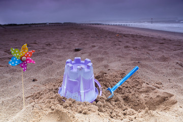 Beaches lay empty in bad weather at the height of summer at Dawlish Warren, Devon, England, UK