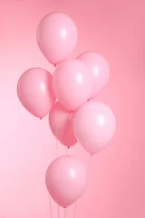 Fotobehang closeup of balloons isolated on pink background © Victoria Andreas