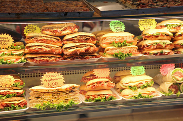 sandwiches stuffed for sale in the bar in italy with the price