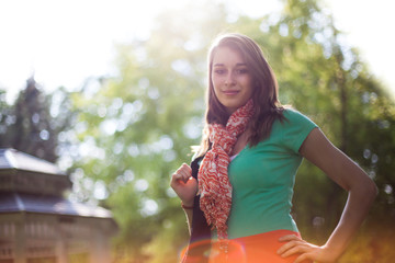 Smiling and Sunlit Beautiful Young Woman with Cloth Shopping Bag