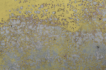 Cracked and peeling paint on an old car.