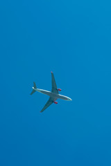 Airplane flying against the blue sky