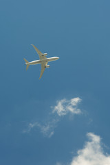 Airplane flying against the blue sky