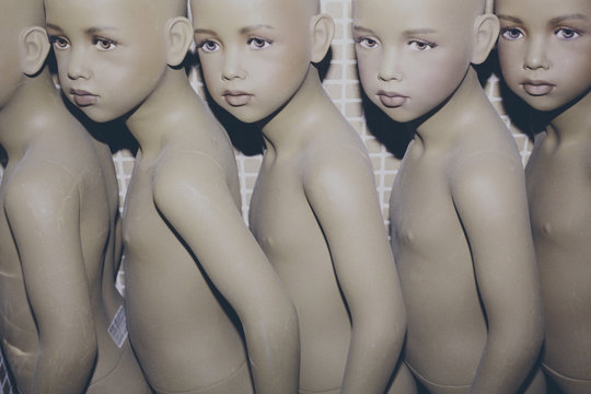 Row of mannequin children