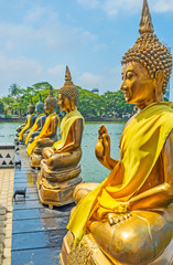 Golden statues on Beira lake in Colombo