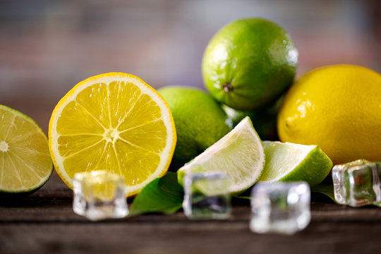 sliced lemons and lime summer freshness fruits background.