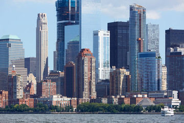 Fototapeta na wymiar New York City Manhattan view from Hudson river with skyscrapers in a clear sunny day
