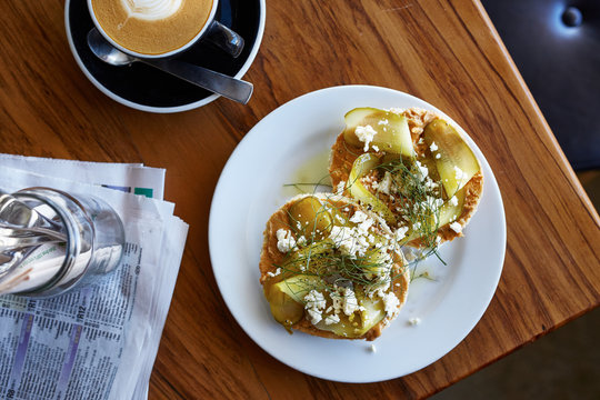 Two delicious sandwiches and cup of latte
