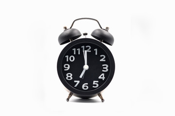 Vintage style alarm clock on white background
