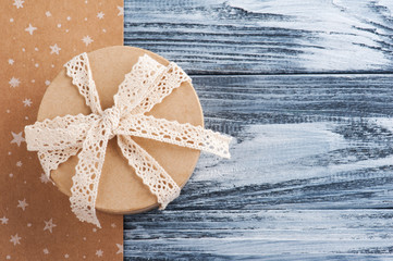 Hand crafted gift with lace bow, on kraft