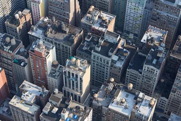 Gordijnen New York City Manhattan aerial view with buildings roof tops and streets © andersphoto