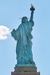 Fototapeta na wymiar Statue of Liberty back view in New York in a sunny day