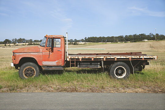 Old pick up / flat tray truck on the side of a country road in Australia