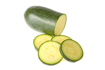 Green zucchini, sliced on white background
