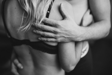 Young couple in underwear hugging