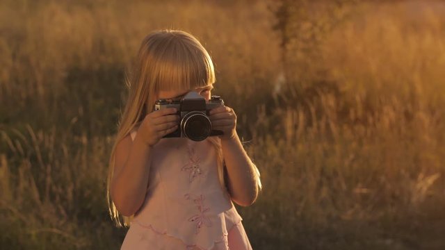 Little girl with camera
