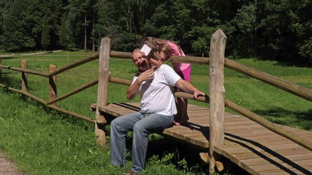 Father make fun with daughter in the park