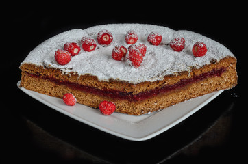 Gingerbread with strawberry jam on the plate