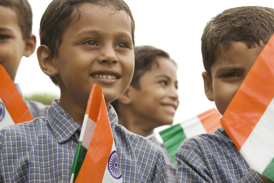 School boys holding the Indian flag 