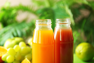 Delicious juices in bottles, closeup
