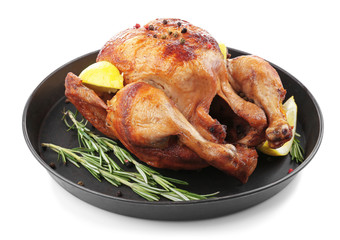 Baking dish with tasty homemade lemon chicken on white background