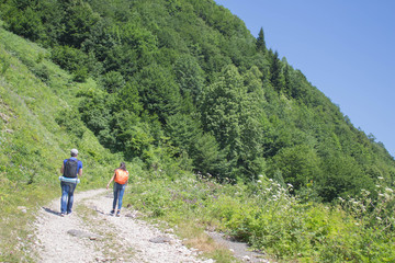 Active and healthy lifestyle on summer vacation and weekend tour. Active hikers. Travel adventure and hiking activity
