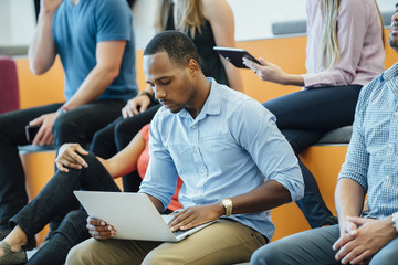 Group of people enjoying a lecture in a modern auditorium