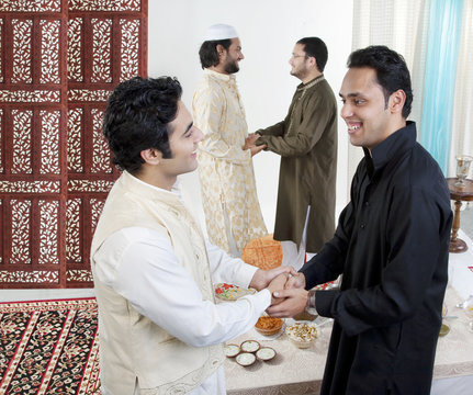 Muslim men greeting each other 