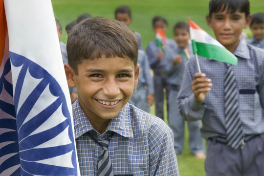 Portrait of a school boy with the Indian flag 