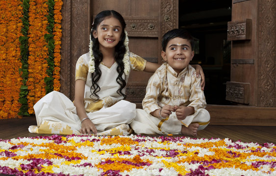 South Indian girl sitting with her brother 