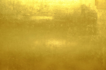 Golden background is part of huge reclining Buddha statue in a famous temple in  Bangkok , Thailand