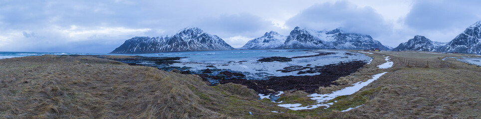Fototapeta na wymiar Travel Concepts, Ideas and Destinations. Panoramic View of Beautiful Stony Haukland Utaklev Beach at Lofoten Islands in Northern part of Norway.