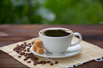 coffee in coffee cup with natural grains
