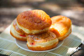 delicious appetizing Doughnuts with stuffed on plate