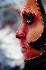 Close-up beauty red art make-up portrait of halloween woman Witch baroque.