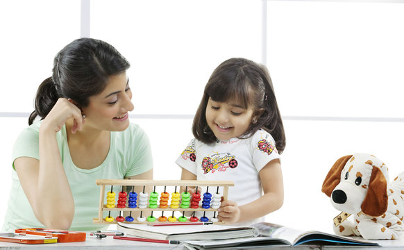 Mother and daughter with an abacus 
