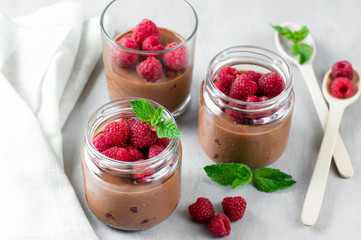 Chocolate mousse with raspberry in a glass