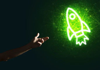 Man palm presenting Rocket web icon as technology concept