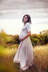 Fototapeta na wymiar Beautiful young pregnant woman (retouched)