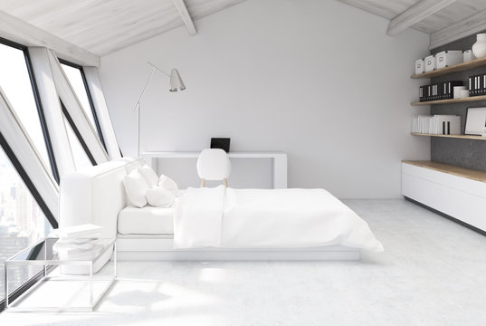 White bedroom in an attic, side view